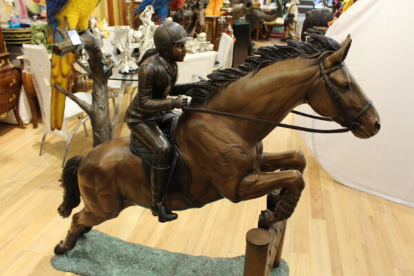 Jockey and Horse Jump a Fence Bronze Statue -  Size: 60"L x 30"W x 51"H.