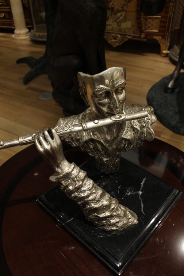 Man playing Flute Bronze Statue -  Size: 10"L x 8"W x 10"H.