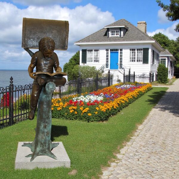 Boy Sitting by a Mailbox reading a book Bronze Statue -  16"L x 20"W x 50"H. - Image 2