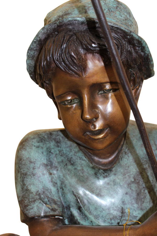 Boy Sitting on a Tree and Fishing Bronze Statue -  Size: 36"L x 21"W x 37"H.