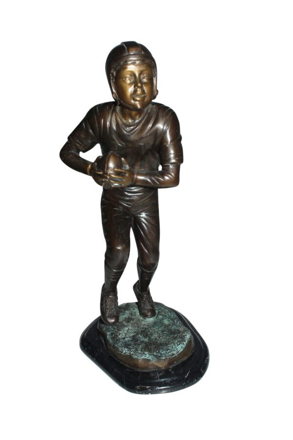 Boy playing football Bronze Statue -  Size: 10"L x 8"W x 20"H.