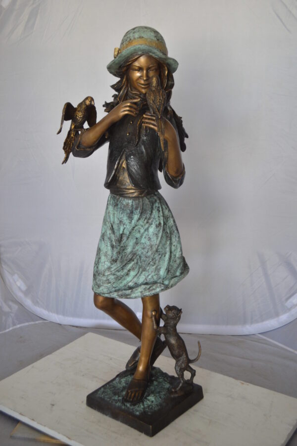 Standing girl with parrots Bronze Statue -  Size: 15"L x 16"W x 41"H.