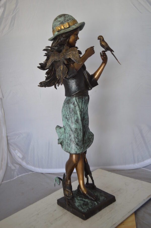 Standing girl with parrots Bronze Statue -  Size: 15"L x 16"W x 41"H.