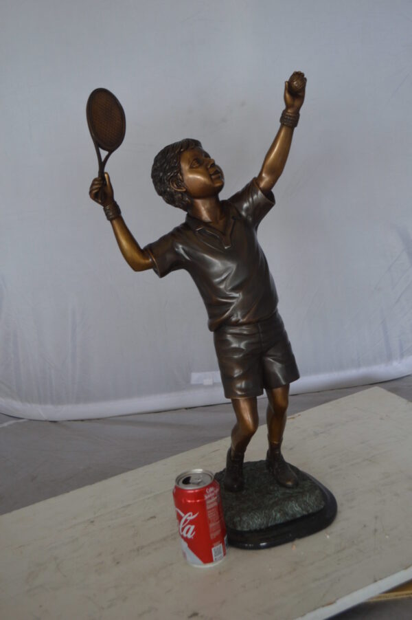 Boy Playing Tennis Bronze Statue -  Size: 12"L x 8"W x 25"H.