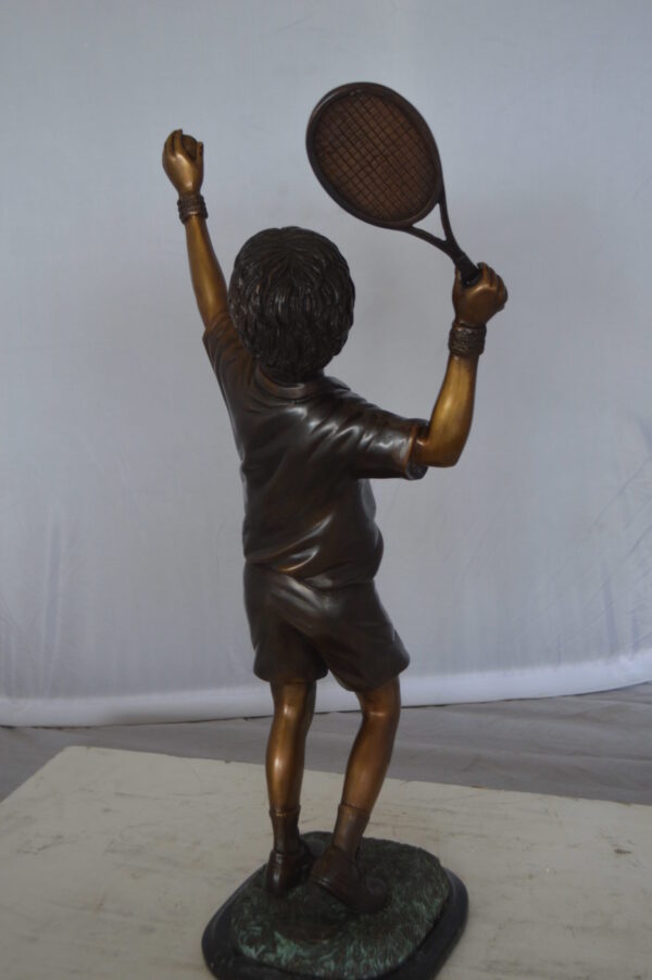 Boy Playing Tennis Bronze Statue -  Size: 12"L x 8"W x 25"H.