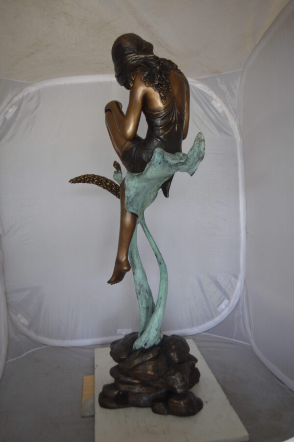 Beautiful Young Girl Sitting on a Tree Bronze Statue -  35"L x 50"W x 55"H.