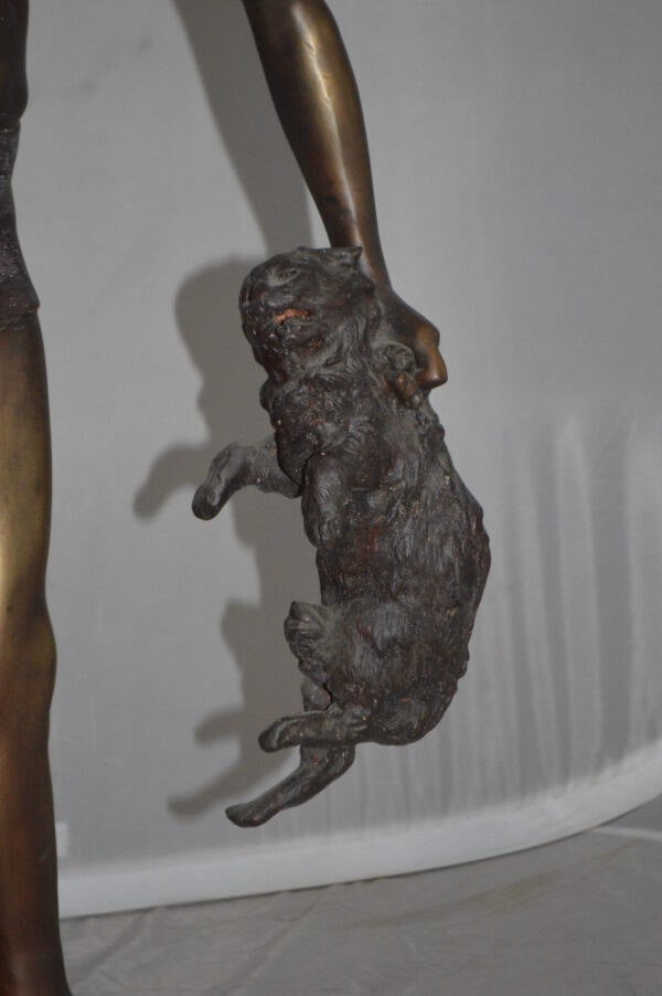 Boy holding a Dog and a Bird Bronze Statue -  Size: 15"L x 15"W x 36"H.