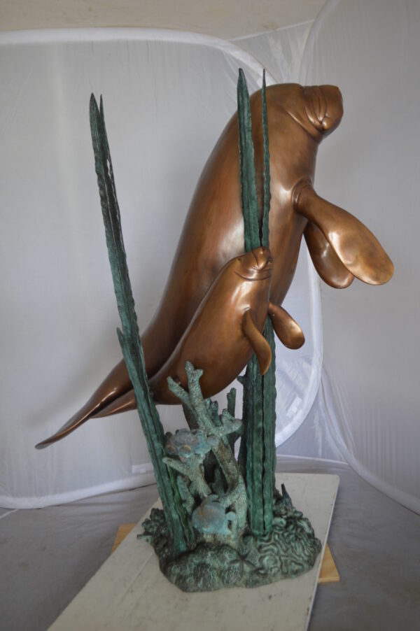 Two Large Manatees swimming Bronze Fountain Statue -  Size: 23"L x 42"W x 42"H.