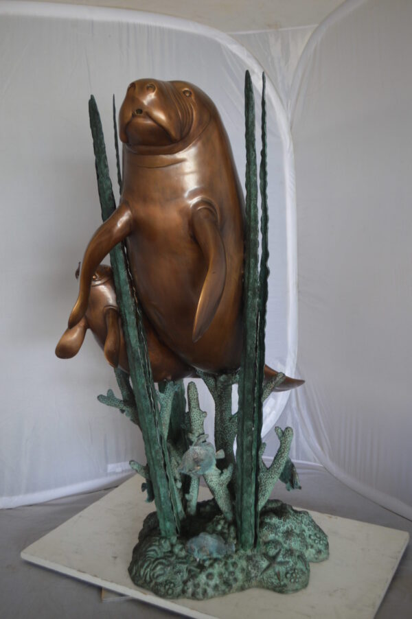 Two Large Manatees swimming Bronze Fountain Statue -  Size: 23"L x 42"W x 42"H.