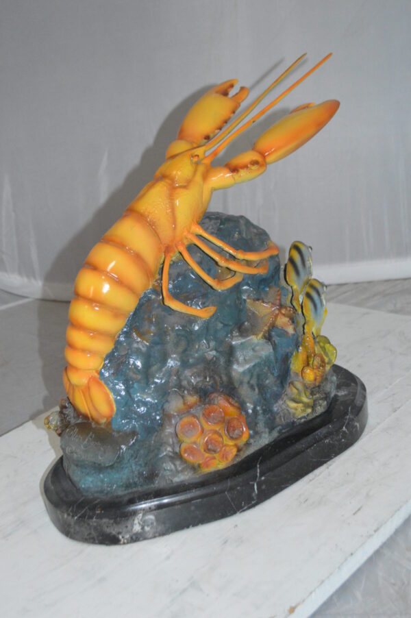 Lobster with Fish Bronze Statue -  Size: 9"L x 18"W x 16"H.