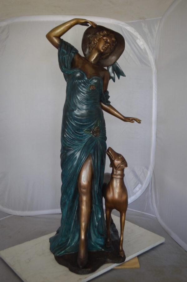 Lady With Her Dog Bronze Statue -  Size: 25"L x 22"W x 50"H.