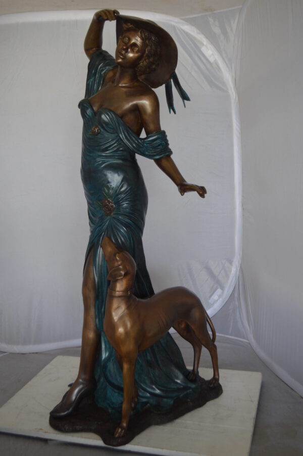 Lady With Her Dog Bronze Statue -  Size: 25"L x 22"W x 50"H.