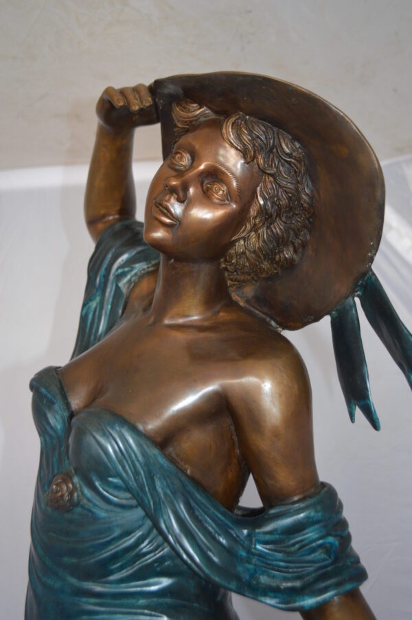 Lady With Her Dog Bronze Statue -  Size: 25"L x 22"W x 50"H.