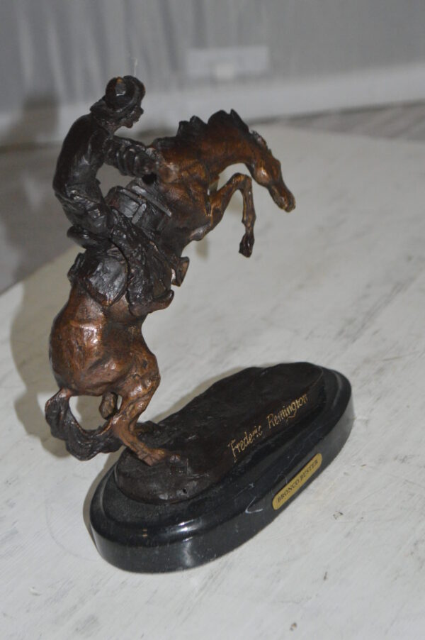 Bronco Buster by Remington Bronze Statue -  3" x 7" x 10"H.