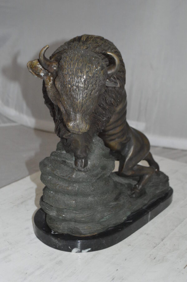 Bison Bronze Statue -  Size: 7"L x 14"W x 15"H.