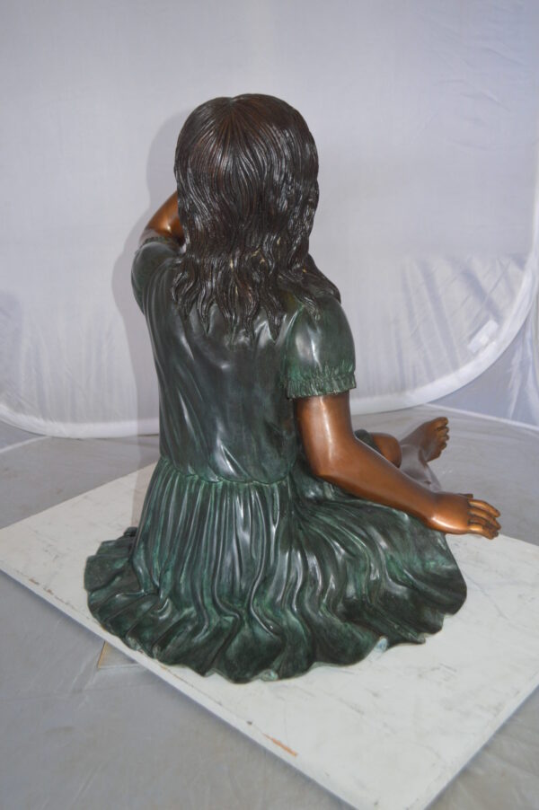 Girl with a Sparrow Bronze Statue -  Size: 24"L x 30"W x 25"H.