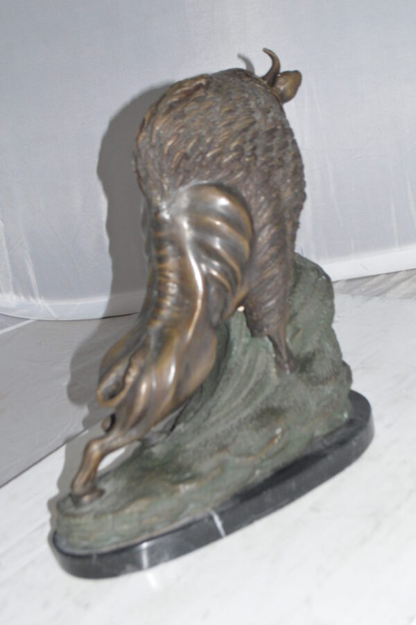 Bison Bronze Statue -  Size: 7"L x 14"W x 15"H.