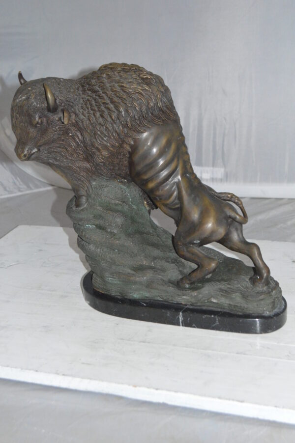 Bison Bronze Statue -  Size: 7"L x 14"W x 15"H.