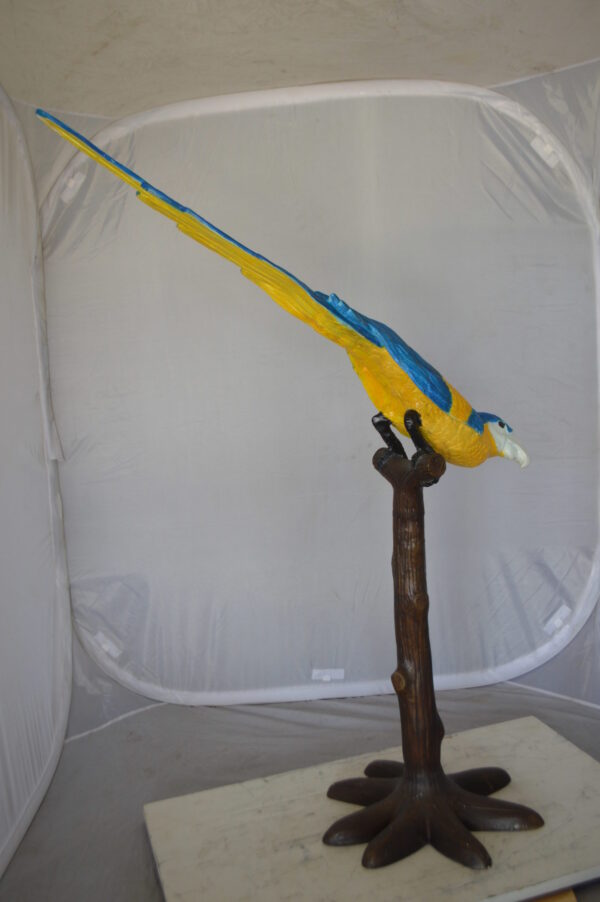 Parrot on Tree - Head Down Bronze Statue -  Size: 39"L x 15"W x 47"H.