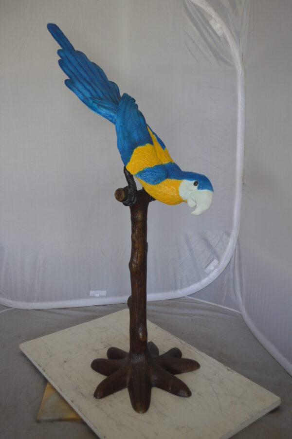 Parrot on Tree - Head Down Bronze Statue -  Size: 39"L x 15"W x 47"H.