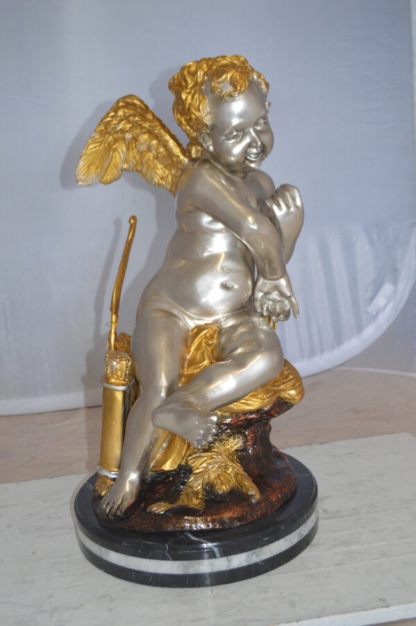 Cupid Girl On A Rock Bronze Statue  -  Size: 20"L x 15"W x 25"H.