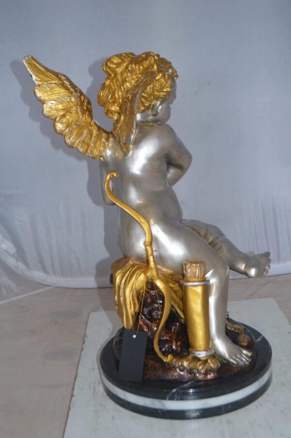Cupid Girl On A Rock Bronze Statue  -  Size: 20"L x 15"W x 25"H.