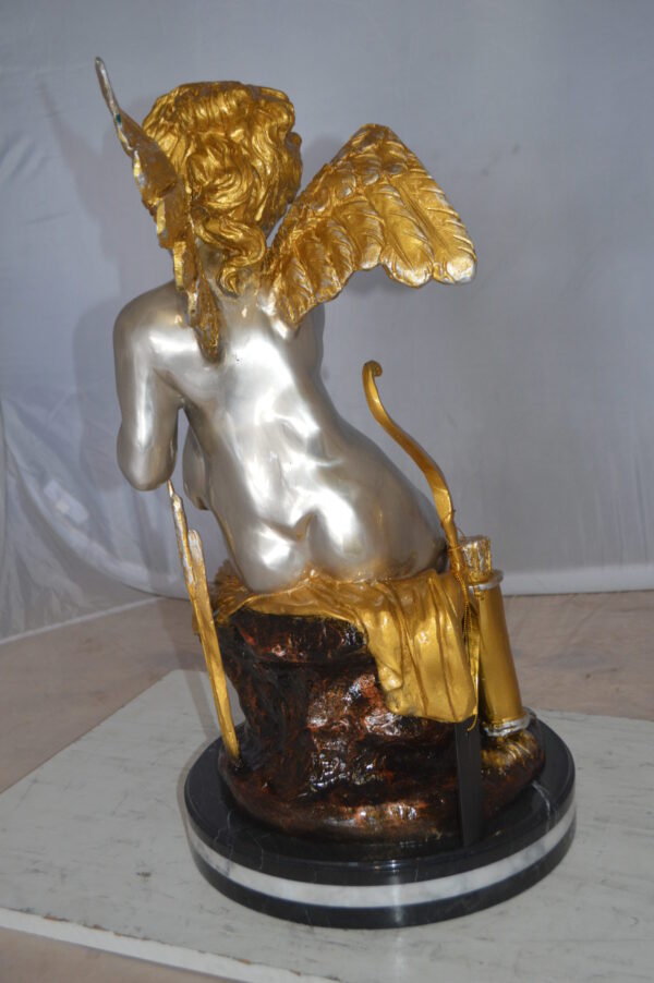 Cupid Girl On A Rock Bronze Statue  -  Size: 20"L x 15"W x 25"H.