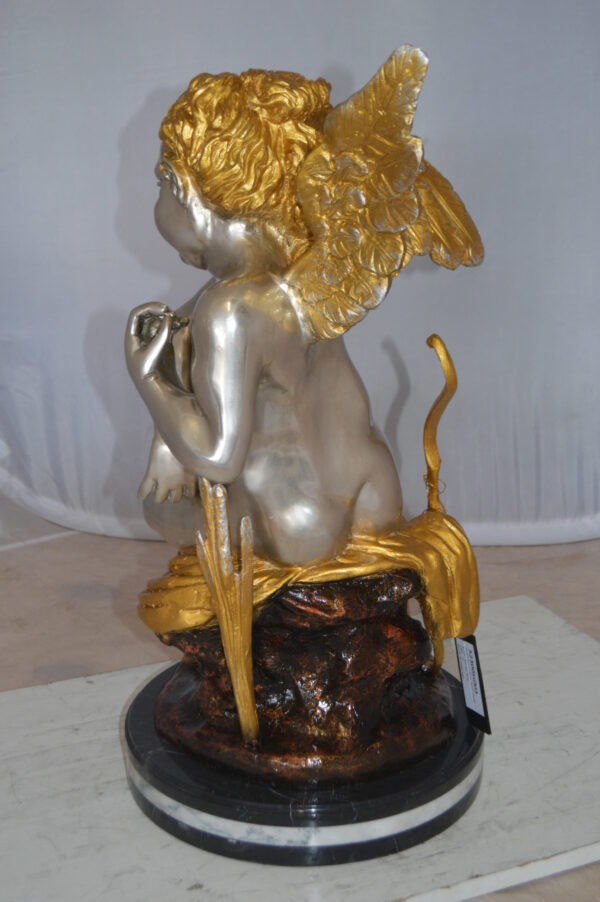 Cupid Girl On A Rock Bronze Statue  -  Size: 20"L x 15"W x 25"H.