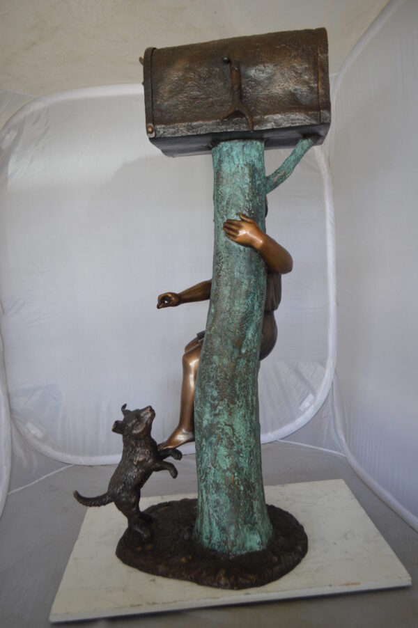 Boy Sitting on a Tree with Mailbox Bronze Statue -  Size: 22"L x 23"W x 49"H.