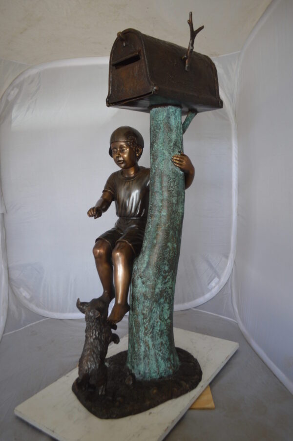 Boy Sitting on a Tree with Mailbox Bronze Statue -  Size: 22"L x 23"W x 49"H.