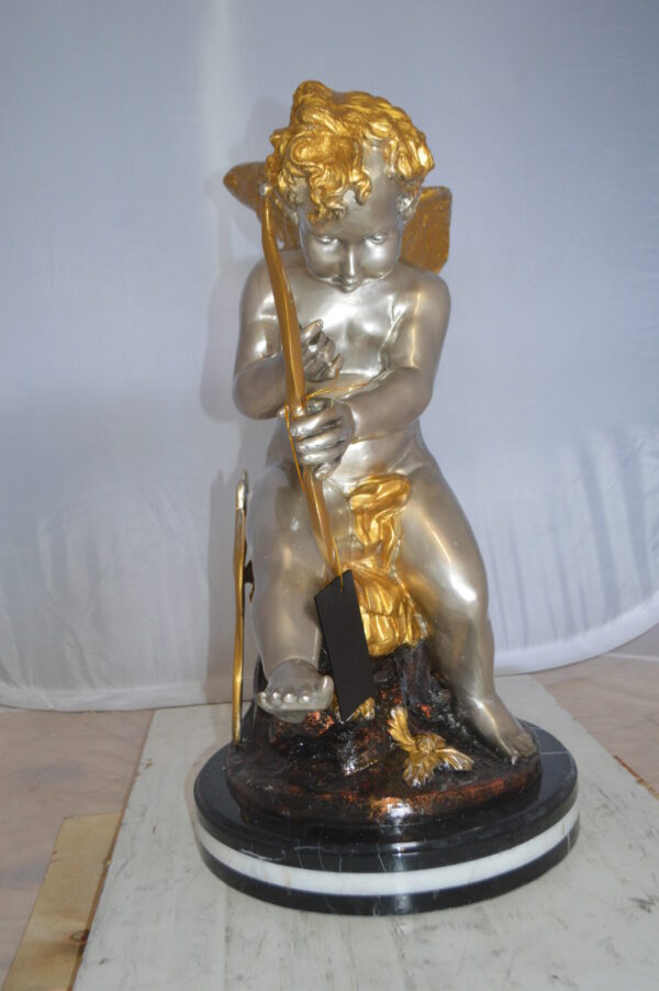 Cupid Boy On A Rock Bronze Statue  -  Size: 20"L x 15"W x 26"H.