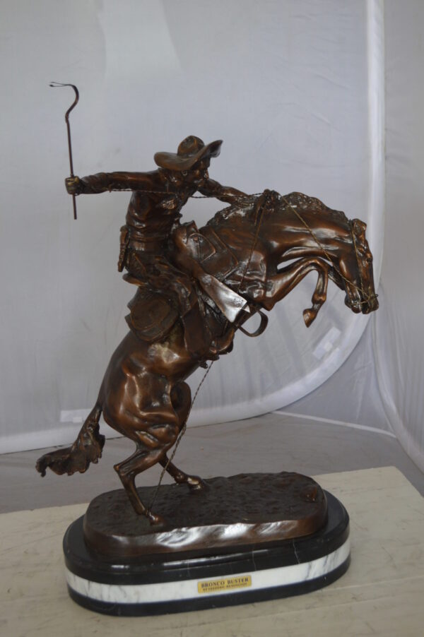 Bronco Buster by Remington Bronze Statue on a triple marble -  21"x 10"x 26"H.