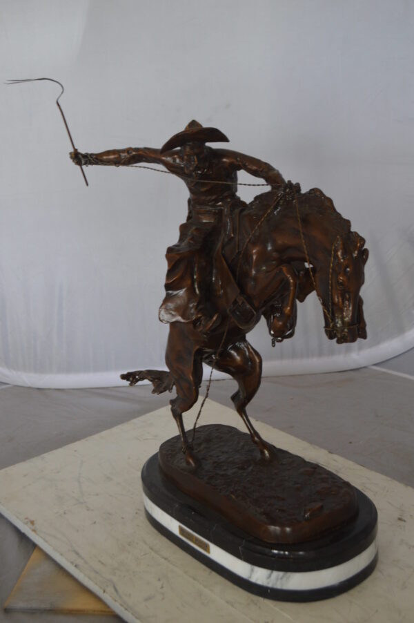 Bronco Buster by Remington Bronze Statue on a triple marble -  21"x 10"x 26"H.