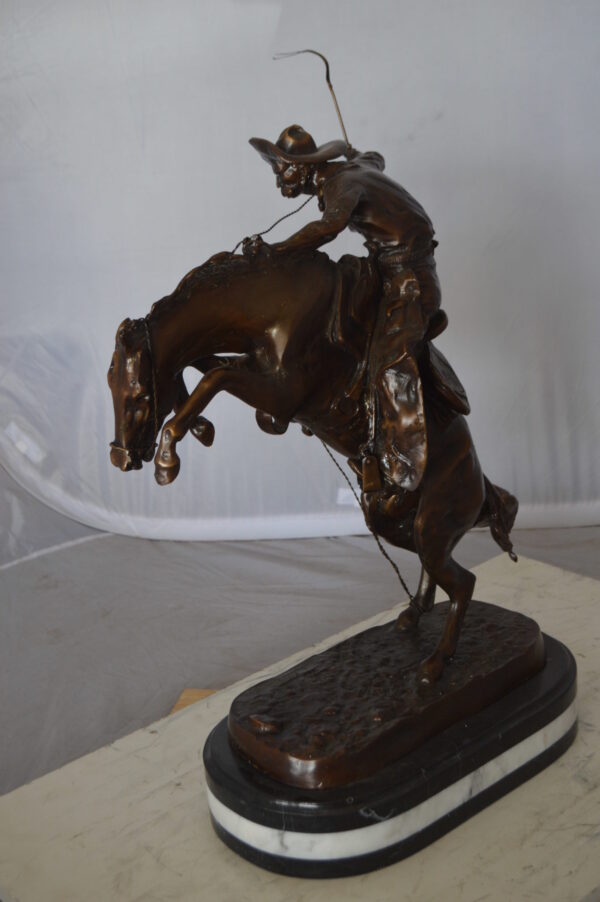 Bronco Buster by Remington Bronze Statue on a triple marble -  21"x 10"x 26"H.