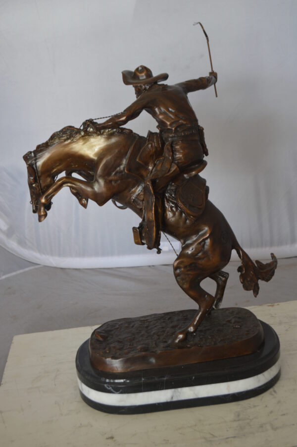 Bronco Buster by Remington Bronze Statue on a triple marble -  21"x 10"x 26"H.