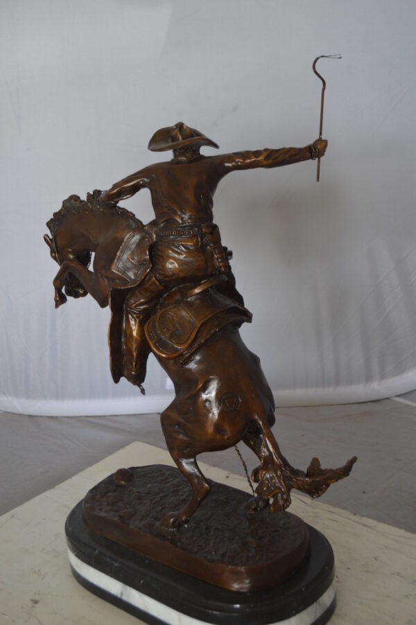 Bronco Buster by Remington Bronze Statue on a triple marble -  21"x 10"x 26"H.