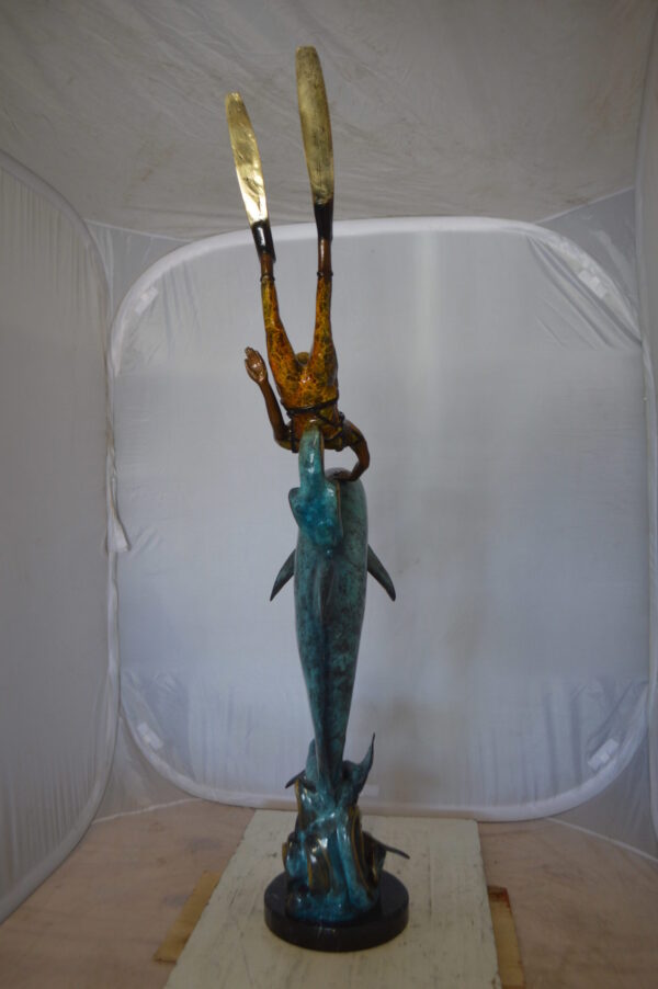 Diver With Dolphin Bronze Statue -  Size: 10"L x 30"W x 49"H.