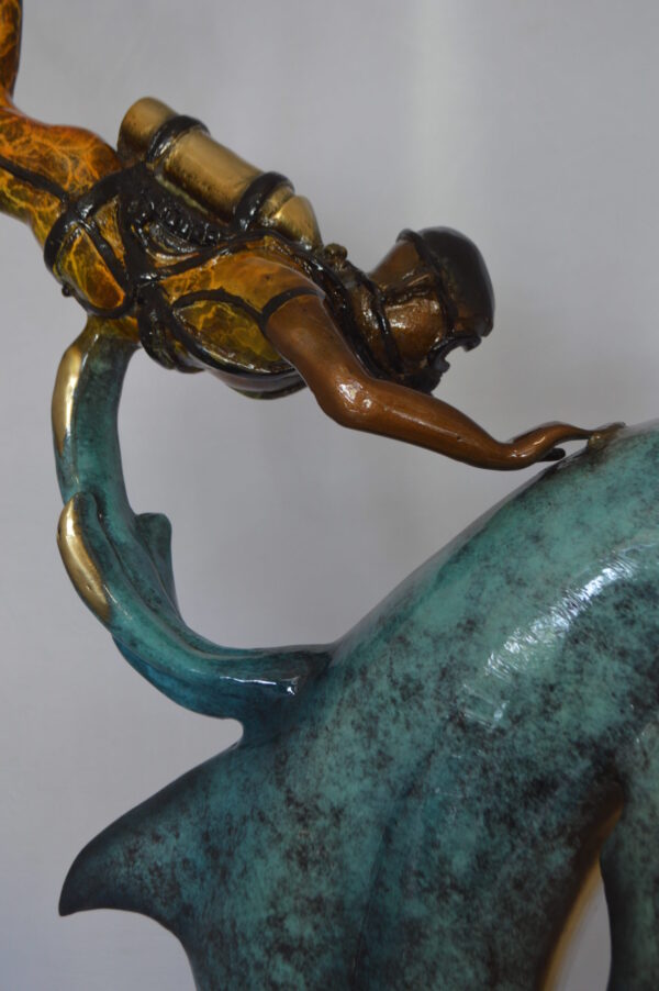 Diver With Dolphin Bronze Statue -  Size: 10"L x 30"W x 49"H.