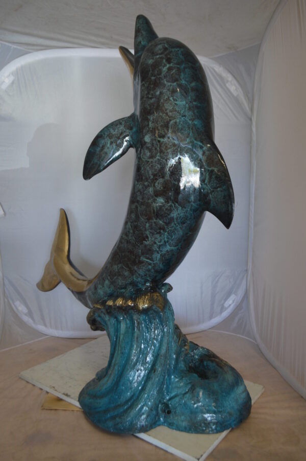 Single Dolphin  On Wave Fountain Bronze Statue -  Size: 48"L x 24"W x 53"H.