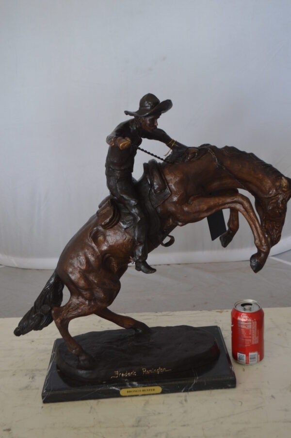 Bronco Buster Bronze Statue by Remington -  Size: 9"L x 24"W x 21"H.
