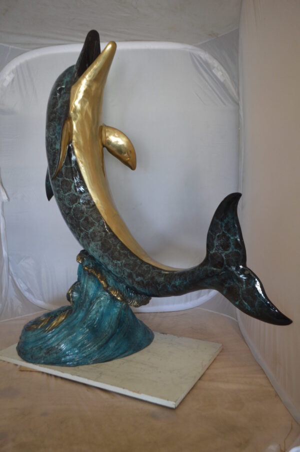 Single Dolphin  On Wave Fountain Bronze Statue -  Size: 48"L x 24"W x 53"H.