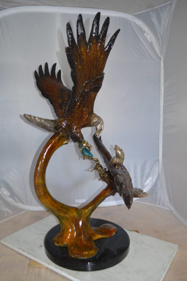 Two Eagles Fighting on Fish Bronze Statue -  Size: 33"L x 28"W x 42"H.