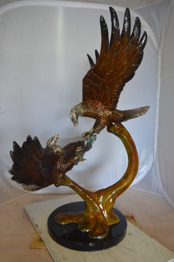 Two Eagles Fighting on Fish Bronze Statue -  Size: 33"L x 28"W x 42"H.