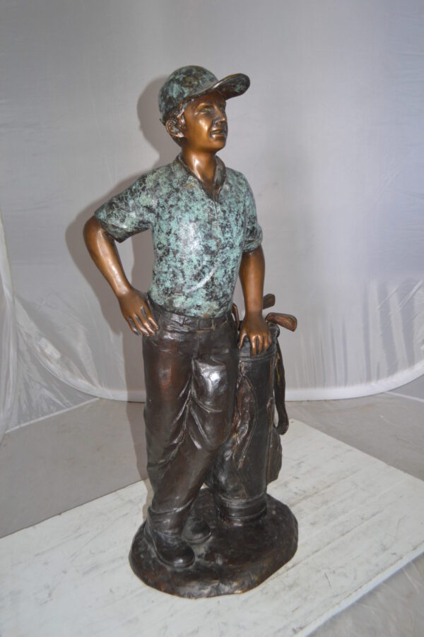 Golfer with bag Bronze Statue -  Size: 12"L x 13"W x 32"H.