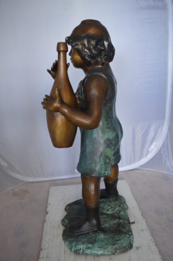 Boy holding a bottle water fountain -  Size: 17"L x 14"W x 38"H.