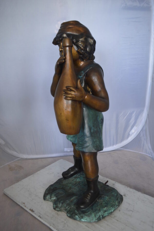 Boy holding a bottle water fountain -  Size: 17"L x 14"W x 38"H.