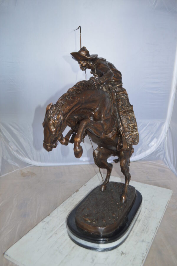 Jumbo Bronco Buster  by Remington Bronze Statue -  Size: 19"L x 11"W x 36"H.