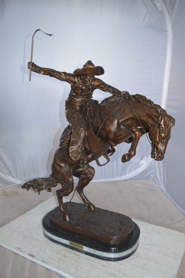 Jumbo Bronco Buster  by Remington Bronze Statue -  Size: 19"L x 11"W x 36"H.