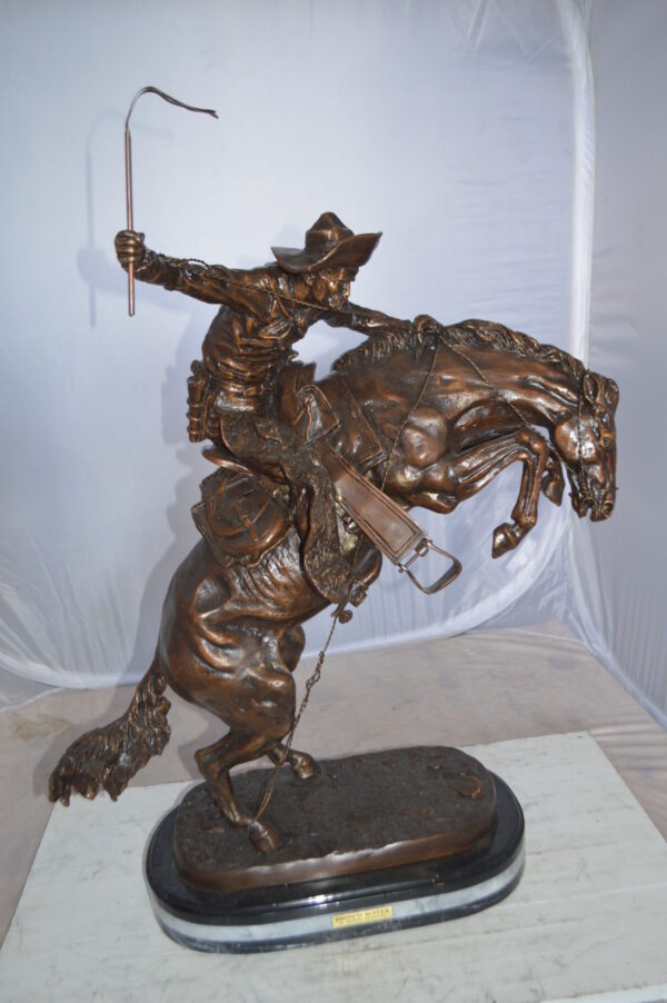 Jumbo Bronco Buster  by Remington Bronze Statue -  Size: 19"L x 11"W x 36"H.