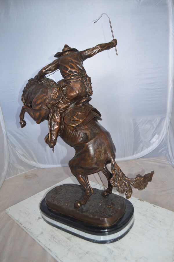 Jumbo Bronco Buster  by Remington Bronze Statue -  Size: 19"L x 11"W x 36"H.